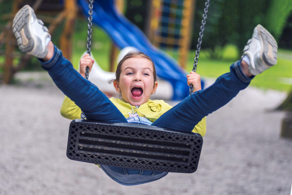 kids swinging on swings